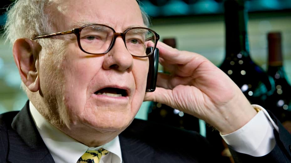 Billionaire investor Warren Buffett, chairman of Berkshire Hathaway, speaks on a mobile phone during an interview in New York, U.S., on Wednesday, June 25, 2008.