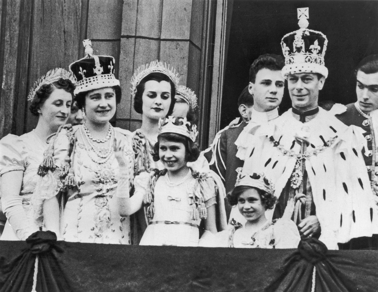Elizabeth, center, at her father’s coronation in May 1937, six months after his brother abdicated.