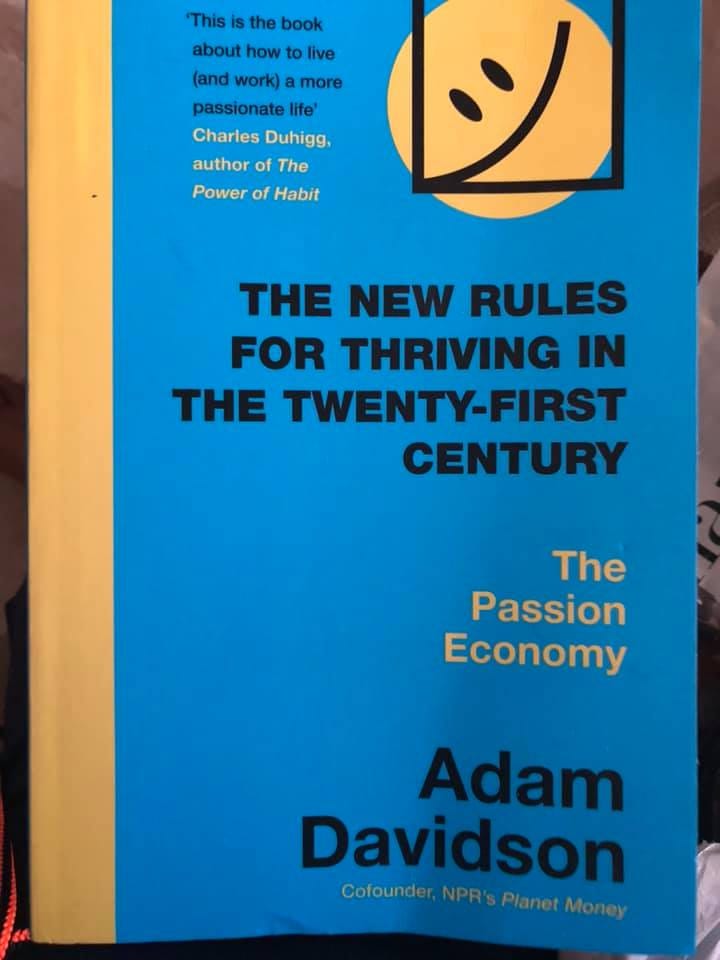 Image may contain: text that says 'This is the book about how to live (and work) more passionate life Charles Duhigg, authorof author The Power of Habit THE NEW RULES FOR THRIVING IN THE TWENTY-FIRST CENTURY The Passion Economy Adam Davidson Cofounder, NPR's Planet Money'