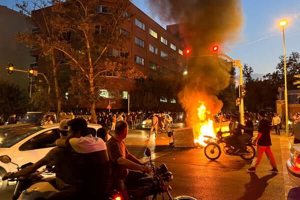 A fire burning during a protest in Tehran on Monday.