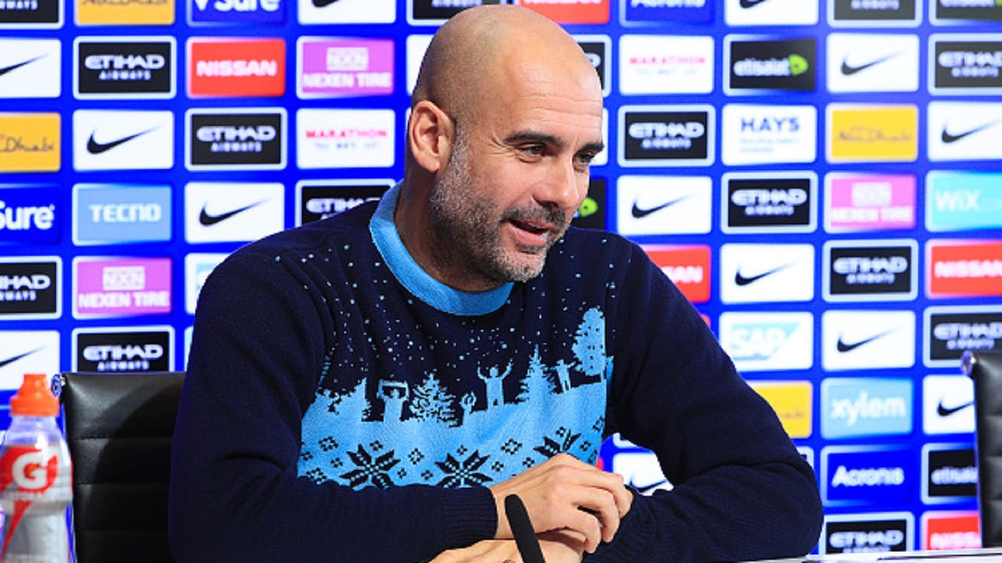 VIRAL: Pep turns up to press conference with Christmas jumper | Goal.com
