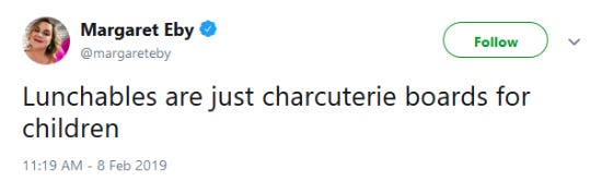 Screenshot of a funny tweet about charcuterie boards