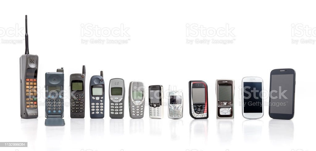 Old Mobile Phone from past to present on white background. Old Mobile Phone from past to present on white background. Old Stock Photo
