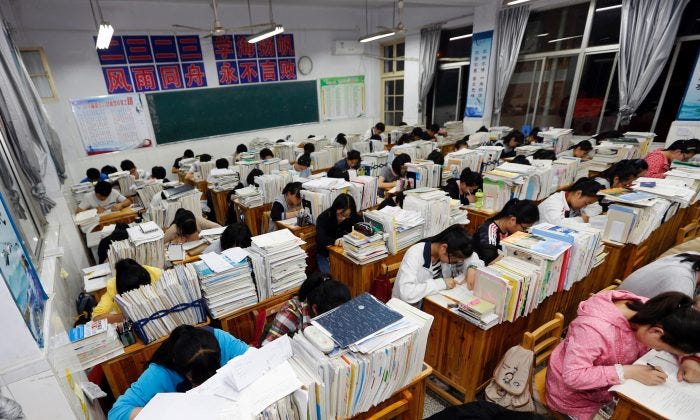 Senior high school students studying at night to prepare for the college entrance exams at a high school in Lianyungang, east China's Jiangsu province. (Getty Image)