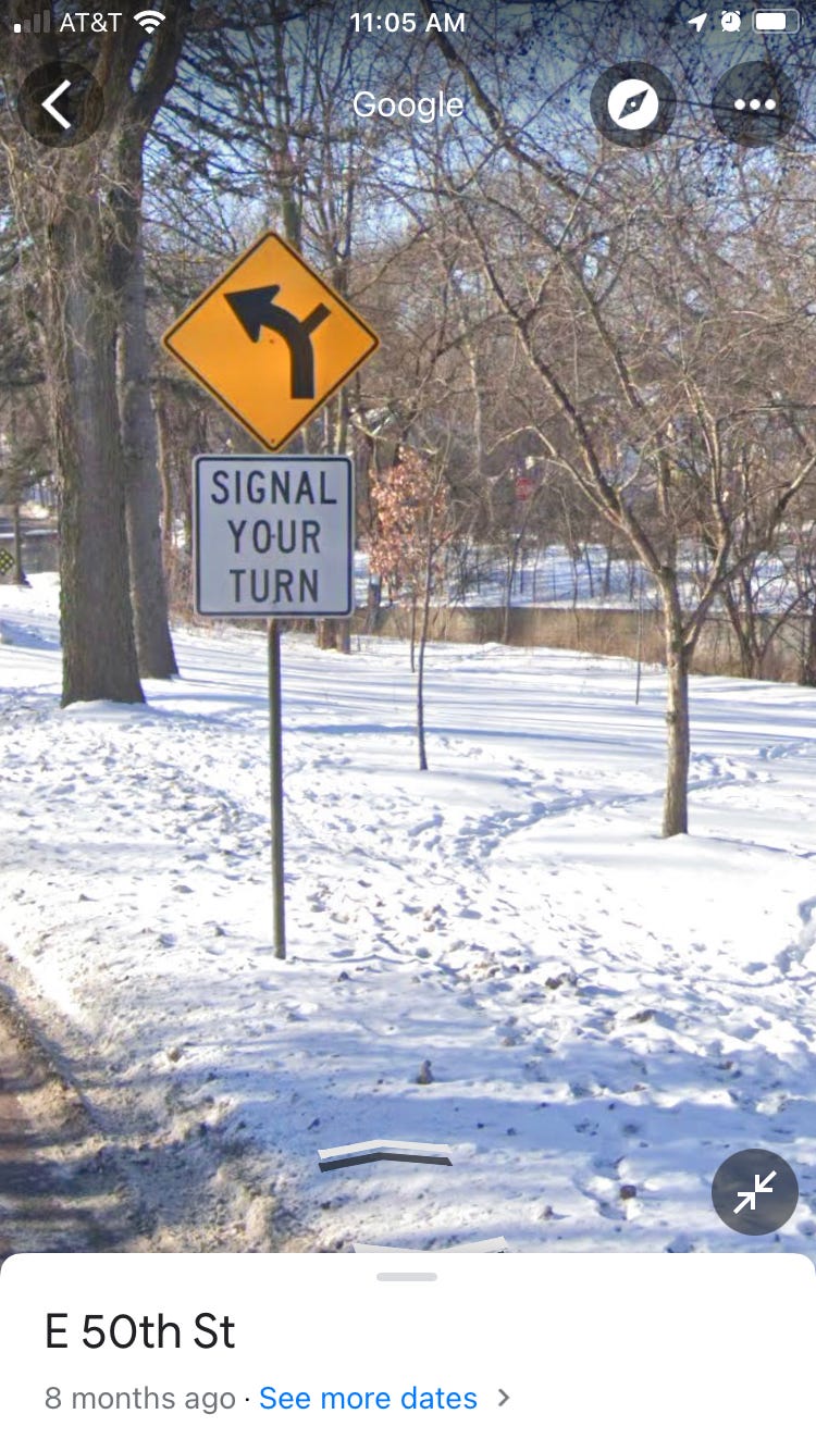Sign urging drivers to signal their turn from Minnehaha Parkway to 50th Street