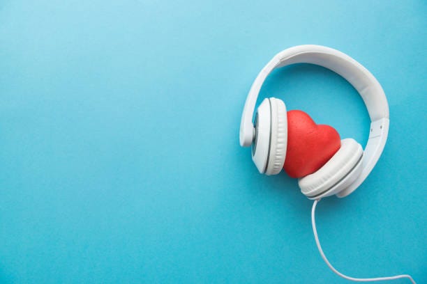 White Headphones With Red Heart Sign In The Middle On Blue Surface Stock  Photo - Download Image Now - iStock