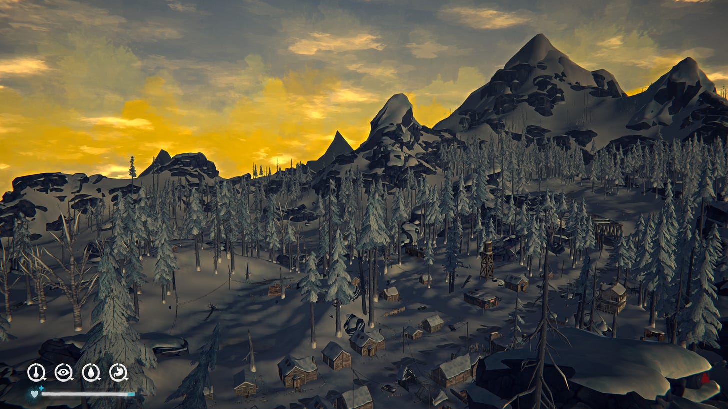 View from a mountain top down over a small town made up of wooden houses and lots of trees. The sun is rising behind mountains.