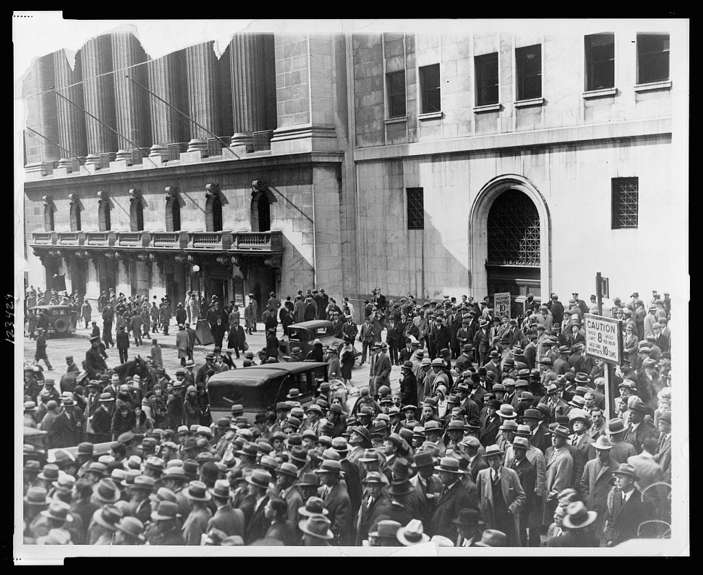 Crowd of people gather outside the New York Stock Exchange following the Crash of 1929]