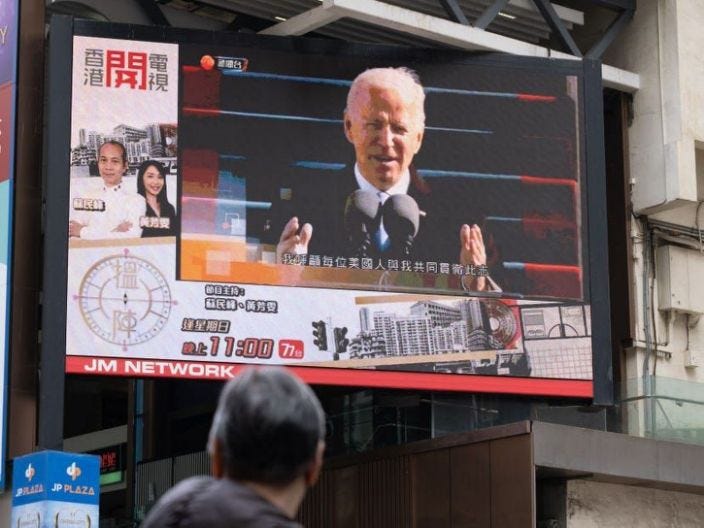 A man watches a report of Biden&#39;s inauguration in Hong Kong