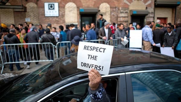 Drivers who assembled in front of the company’s Long Island City office on Feb. 1 to protest Uber’s latest reduction in their rates.