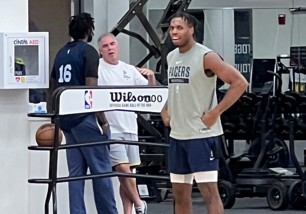 James Johnson talks with Pacers president Kevin Pritchard after practice.