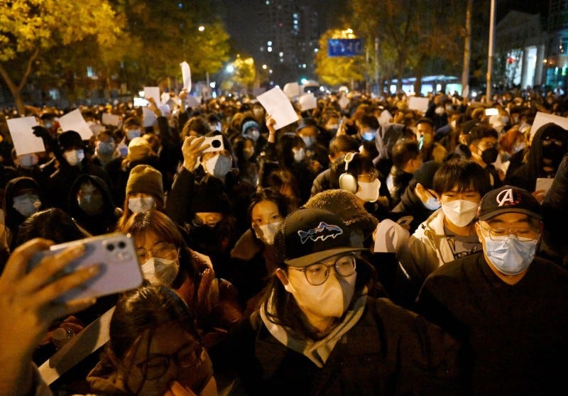 Protesters march during a rally against China's harsh COVID-19 restrictions in Beijing on Nov. 28.