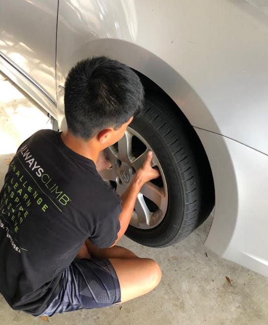 photo boy changing tire