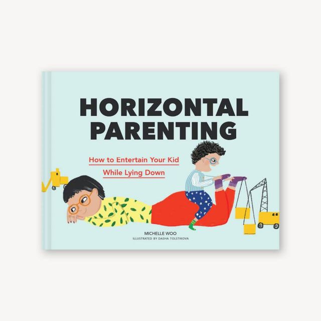 Cover of Michelle Woo's book, Horizontal Parenting: How to Entertain Your Kid While Lying Down. The cover has a cartoon style illustration of an adult lying on their stomach while a child sits on their butt and plays with their feet. 