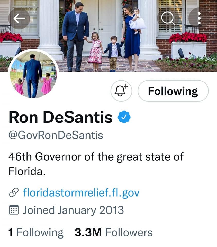 May be a Twitter screenshot of 8 people, people standing and text that says '三 I MUHTE Following Ron DeSantis @GovRonDeSantis 46th Governor of the great state of Florida. floridastormrelief.fl.gov Joined January 2013 1 Following 3.3M Followers'