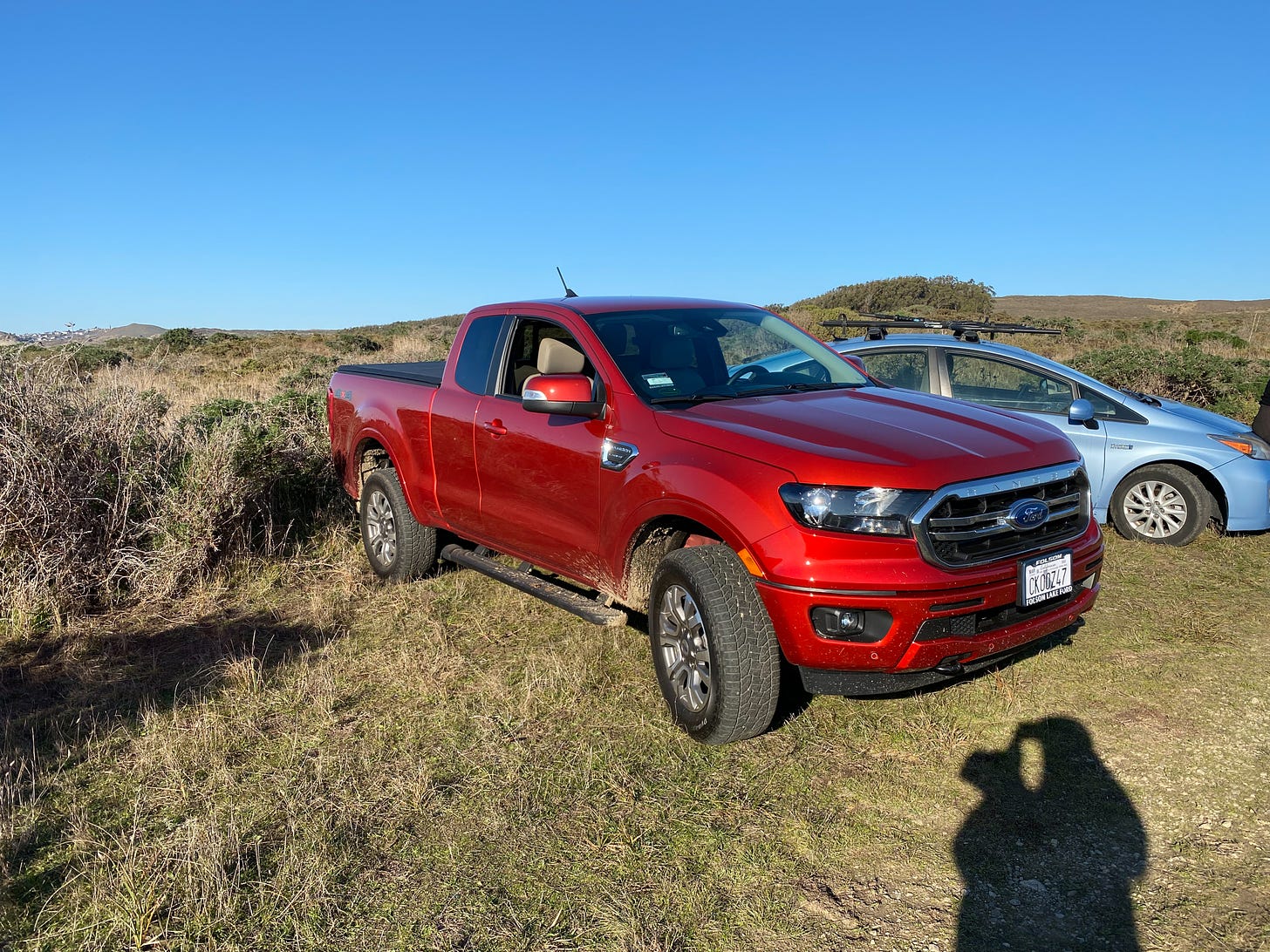 A red Ford Ranger 4x4 truck.