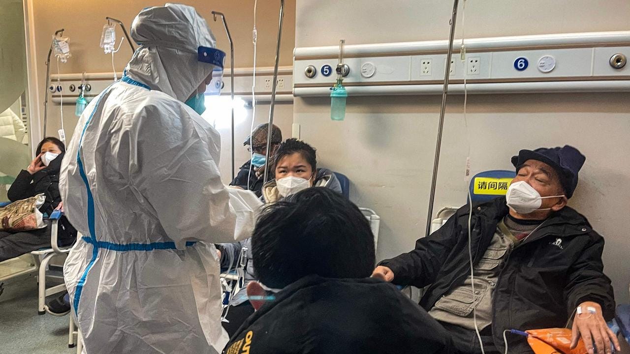 People receive medical attention in a Fever Clinic area in a Hospital in the Changning district in Shanghai, as China battles a wave of coronavirus infections that has hit the elderly hard. Picture: AFP
