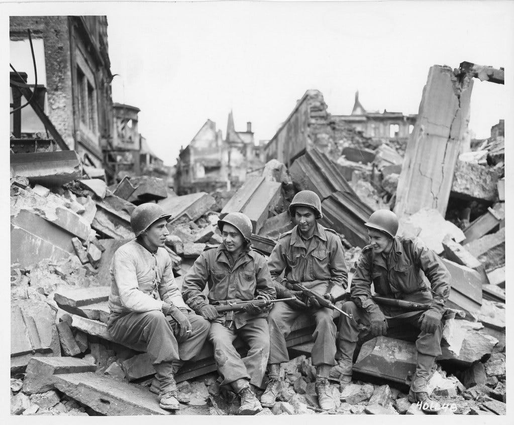 SC 401648 - Combat infantrymen of the 104th Division rest in the ruins of Cologne, Germany, 7 March, 1945.