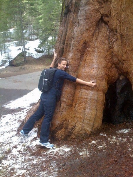 A photo of Margarita hugging a giant tree