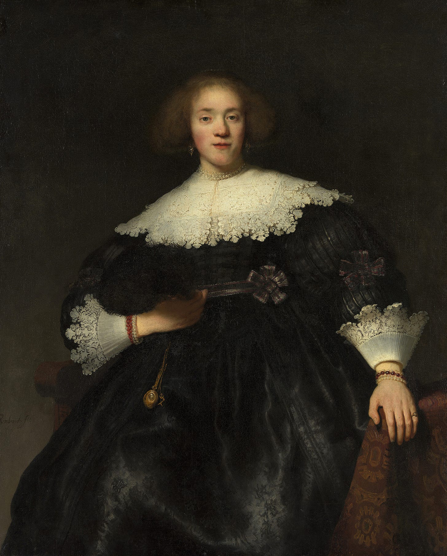 Portrait of a Young Woman with a Fan (1633)by Rembrandt van Rijn