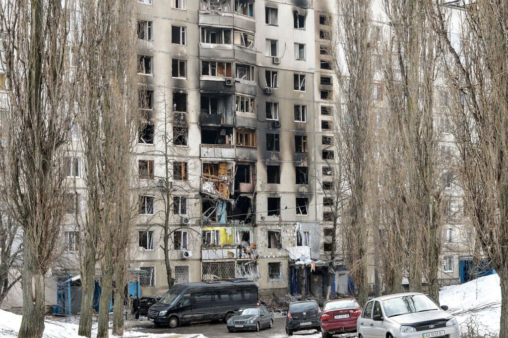 This picture shows apartment building damaged after shelling the day before in Ukraine's second-biggest city of Kharkiv on March 8, 2022.