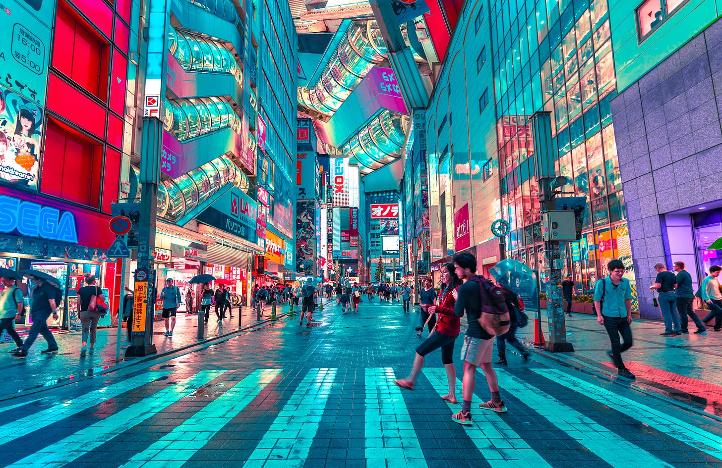 people walking on road near well-lit buildings photo