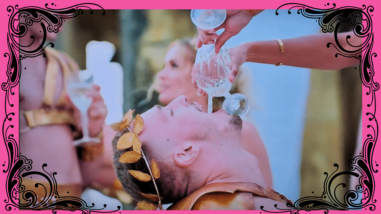 Mr. Cones is fed wine at the Bacchanal Mr. Cones is fed wine at the Bacchanal