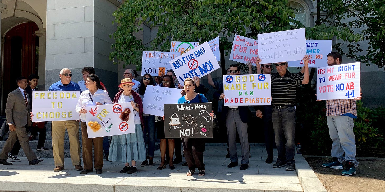 Protesters against AB 44 gather outside the California State Capitol Building in Sacramento on July 9, 2019, after a Senate Judiciary Committee hearing on the bill.