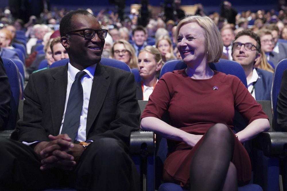 British Chancellor of the Exchequer Kwasi Kwarteng, left, and British Prime Minister Liz Truss at the Conservative Party annual conference at the International Convention Centre in Birmingham, England, Sunday Oct. 2, 2022. (Stefan Rousseau/PA via AP)