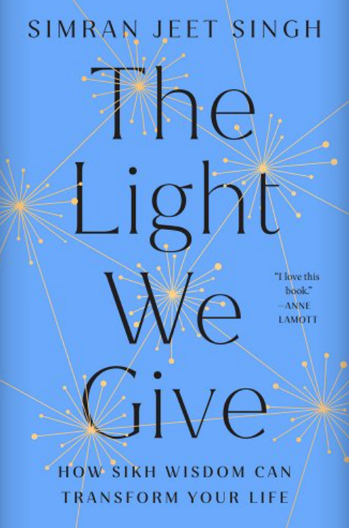 Photo of The Light We Give book cover--blue with yellow light bursts