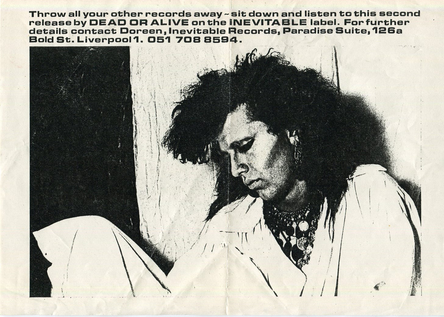 Flyer advertising Dead or Alive. There's a photo of Pete Burns and text saying "Throw all your other records away - sit down and listen to this second release by Dead or Alive on the Inevitable label." It doesn't say what the record is called.