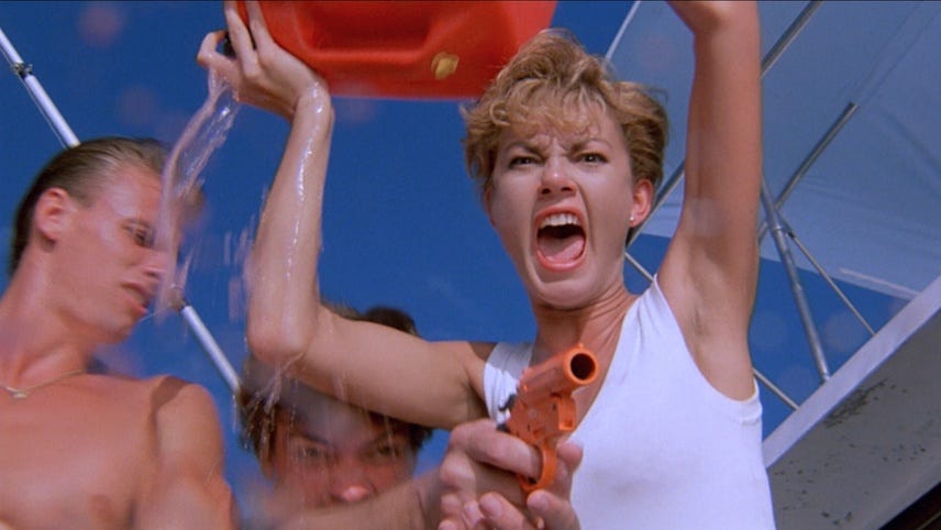 Movie still from Cruel Jaws. A woman screams and throws a tub of gasoline, while a man beside her points a flare gun.