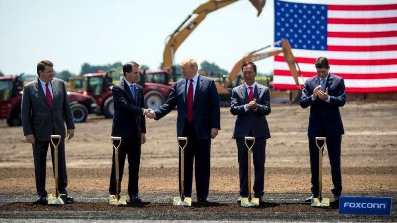 Christopher Tank Murdock, the first Wisconsin Foxconn employee, from left, Wisconsin Gov. Scott Walker, President Donald Trump, Foxconn Chairman Terry Gou and House Speaker Paul Ryan at a groundbreaking for the Foxconn plant June 28, 2018, in Mount Pleasant, Wis.