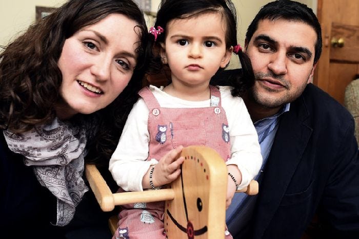 Katherine Behl with daughter Anya, who is 18 months, and father Abhishek. Picture: Lisa Ferguson
