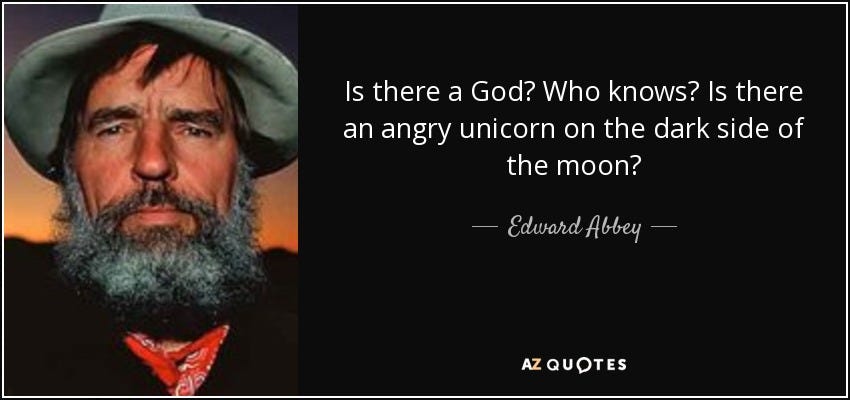 Edward Abbey quote: Is there a God? Who knows? Is there an angry...