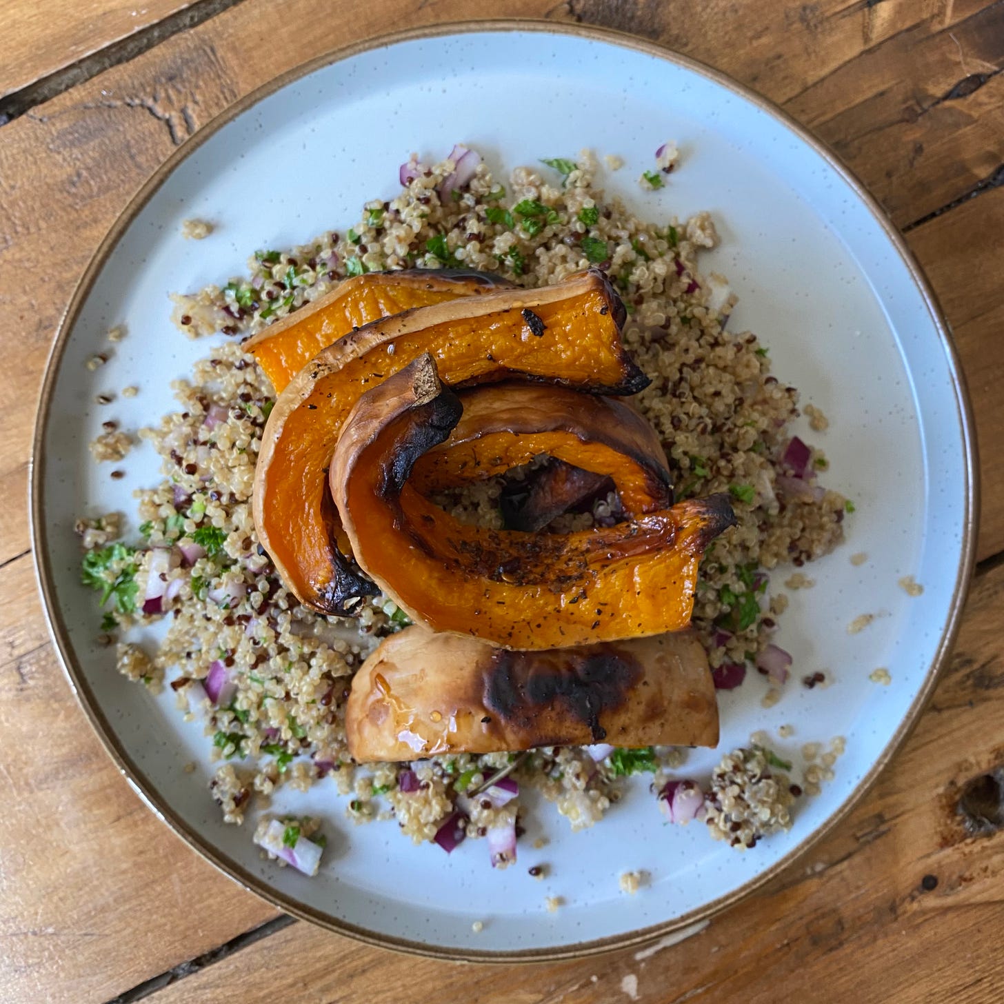 Overhead picture of a plate with quinoa salad and roasted butternut squash