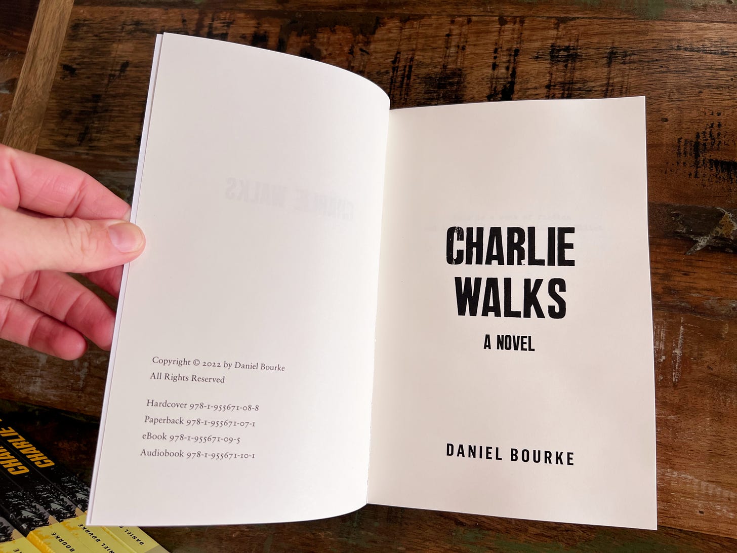inside the front cover of a novel with the title Charlie Walks by Daniel Bourke