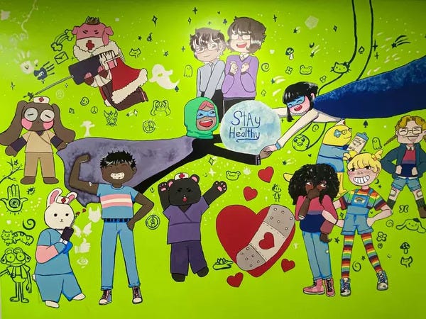A mural drawn by a West Michigan student of children surrounding a heart with a bandaide on it and the legend "Stay Healthy." One of the children is wearing rainbow leggings, which I believe is one of the aspects of this artistic expression of wellness that made local conservative fascists lose their minds.