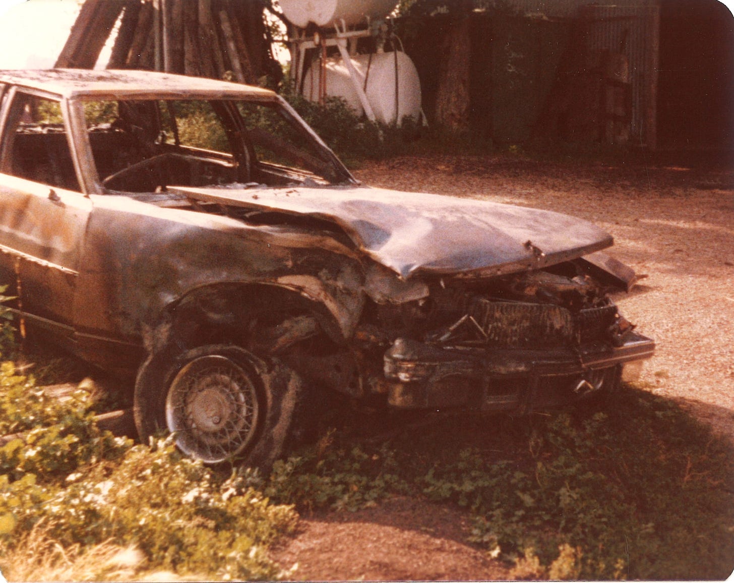 Burned Cadillac Seville front right July1979