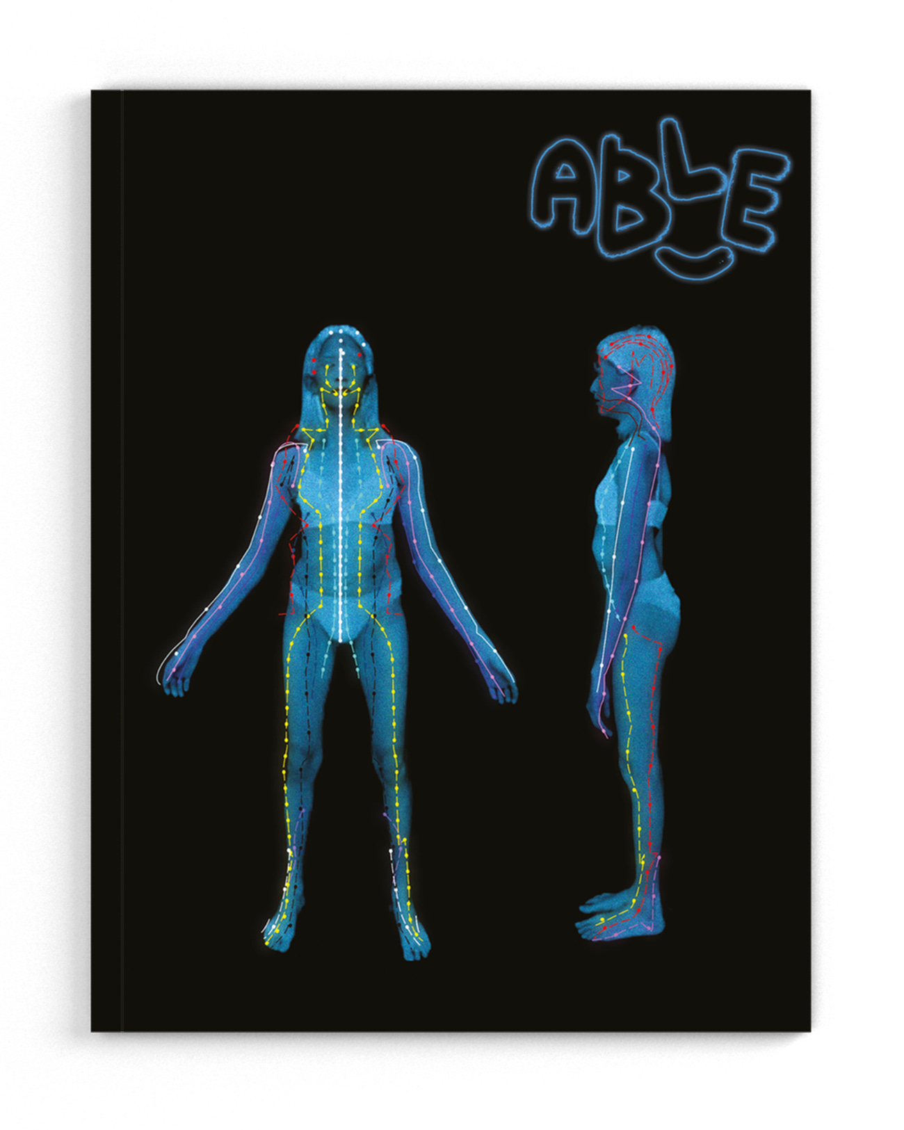 The front cover of Able Issue 2. Two silhouettes of Yo-Yo Lin’s body, one on the right side as a profile and the one on the left side facing forward. The two body shapes are translucent blue with colored lines and dots creating a skeletal map on a black background. The Able zine logo is translucent blue in the top right corner.