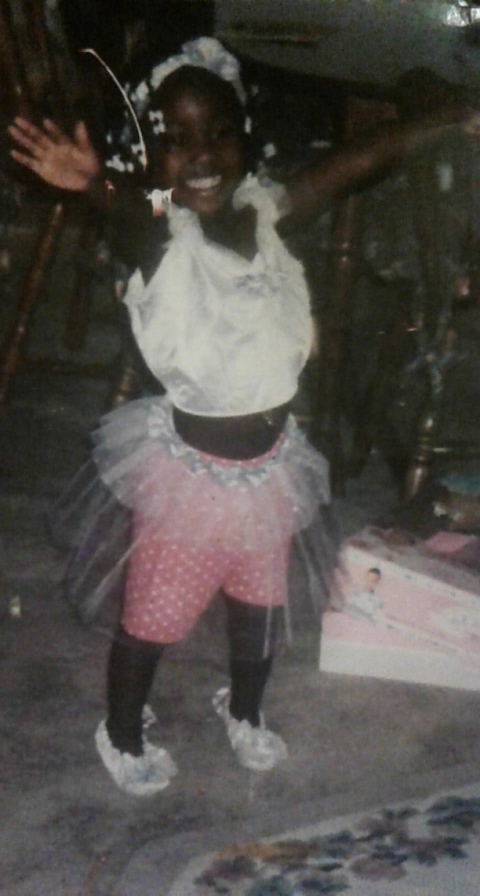 ismatu aged three years old, white Barrettes in hair, wearing a makeshift ballerina costume