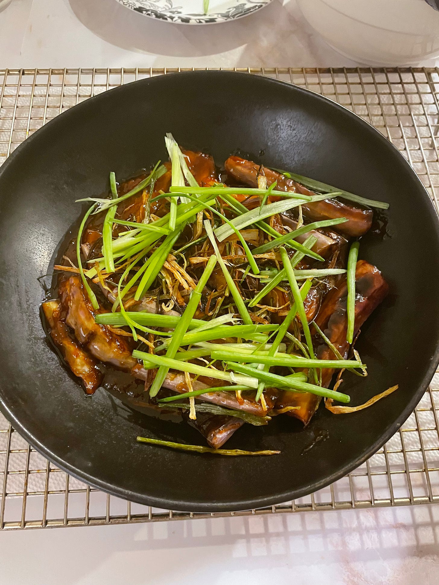 gochujang-glazed eggplant with scallions in a bowl