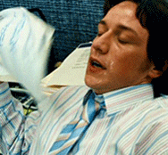 GIF of man, sweating, fanning himself with a stack of papers while breathing heavily