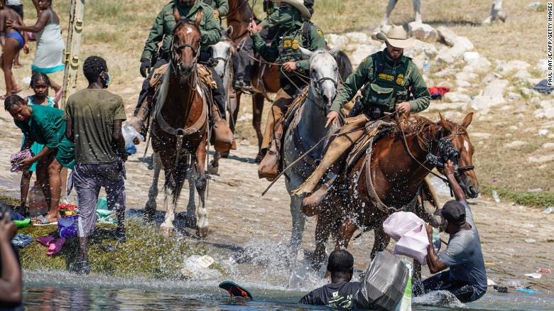 United States Border Patrol agents on horseback tries to stop Haitian migrants from entering an encampment on the banks of the Rio Grande near the Acuna Del Rio International Bridge in Del Rio, Texas on September 19, 2021. - The United States said Saturday it would ramp up deportation flights for thousands of migrants who flooded into the Texas border city of Del Rio, as authorities scramble to alleviate a burgeoning crisis for President Joe Biden&#39;s administration. (Photo by PAUL RATJE / AFP) (Photo by PAUL RATJE/AFP via Getty Images)