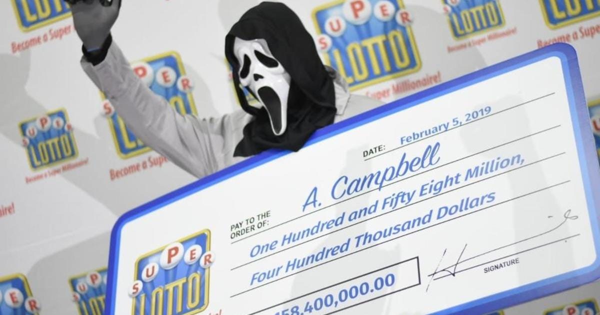 Lottery winner claims prize in "Scream" mask to hide identity - CBS News