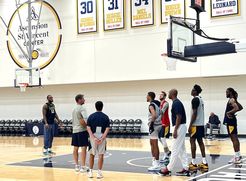 Pacers players getting in competitive shooting games after practice.
