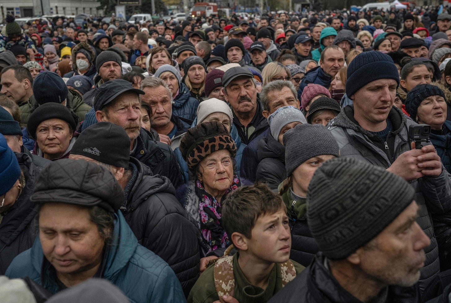 Local residents wait for aid supply distribution in the centre of Kherson on November 18, 2022, amid the Russian invasion of Ukraine. (Photo by Bulent Kilic/AFP via Getty Images)