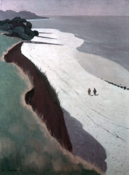 A dazzling white beach runs alongside a brown cliff topped with grass. The sea is calm and the sky is grey. In the distance we can see two tiny figures walking side by side, with their backs to the viewer. They are dwarfed by the landscape.