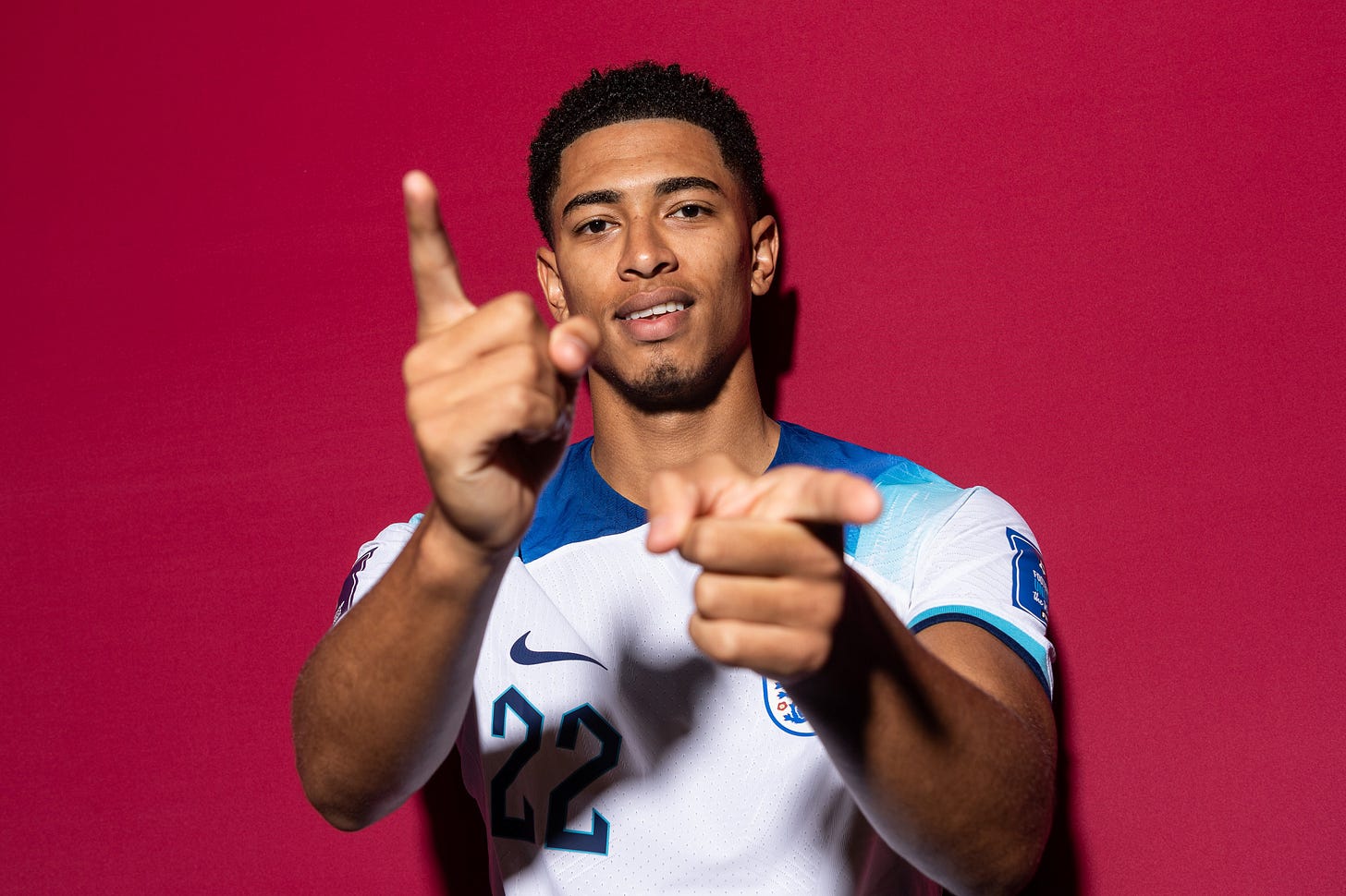 Jude Bellingham poses for a photo in the home England kit.