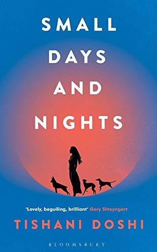 Image of book cover with a silhouette of a woman and dogs on it